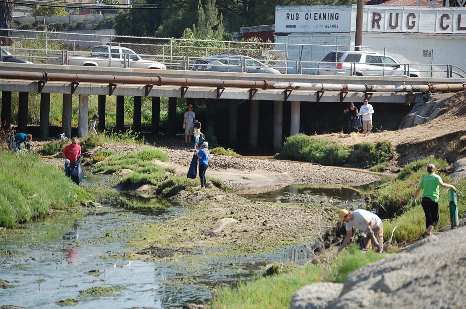 Volunteers working diligently at Javier's cleanup site at last year's Creek to Bay Cleanup
